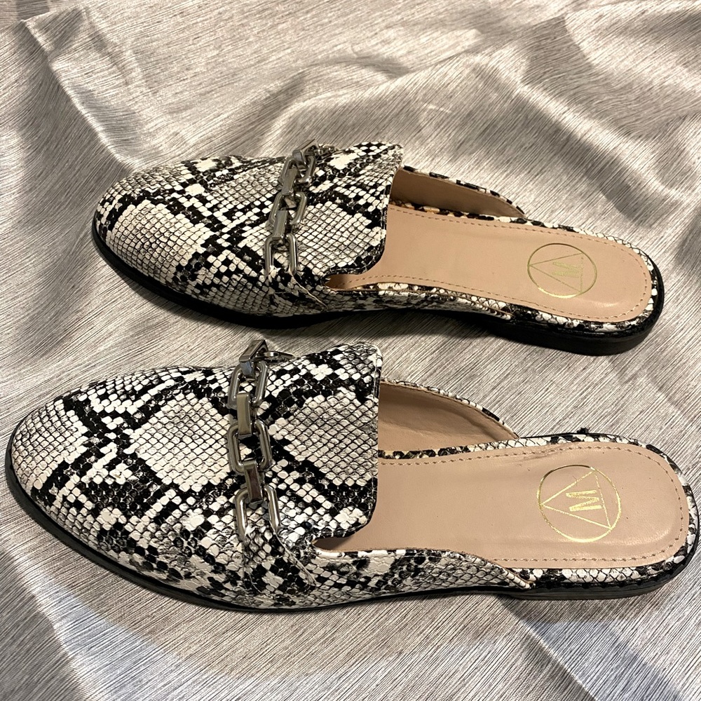 Never worn! Brand new snake skin mule flats.